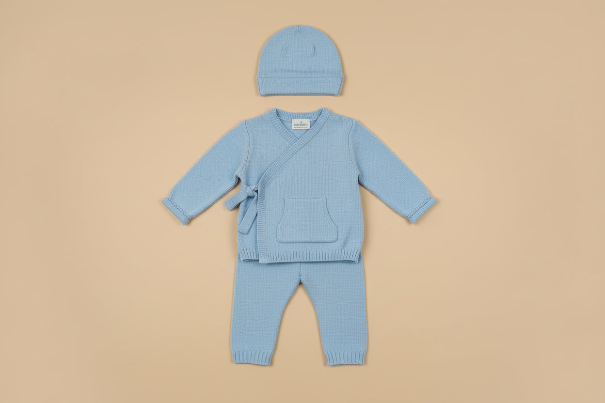 Baby three-piece outfit includes knitted sweater, leggings and hat