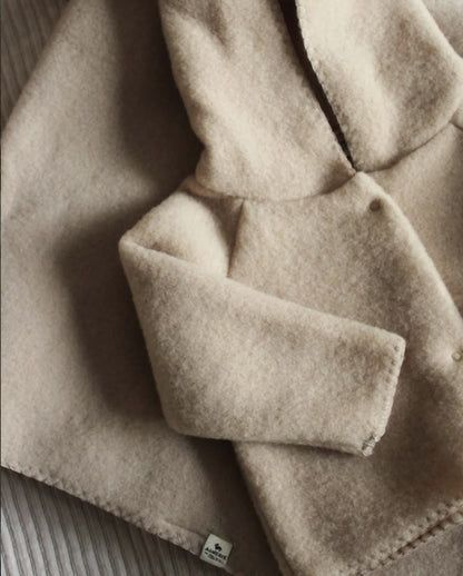 Wollen vest, muts en slofjes